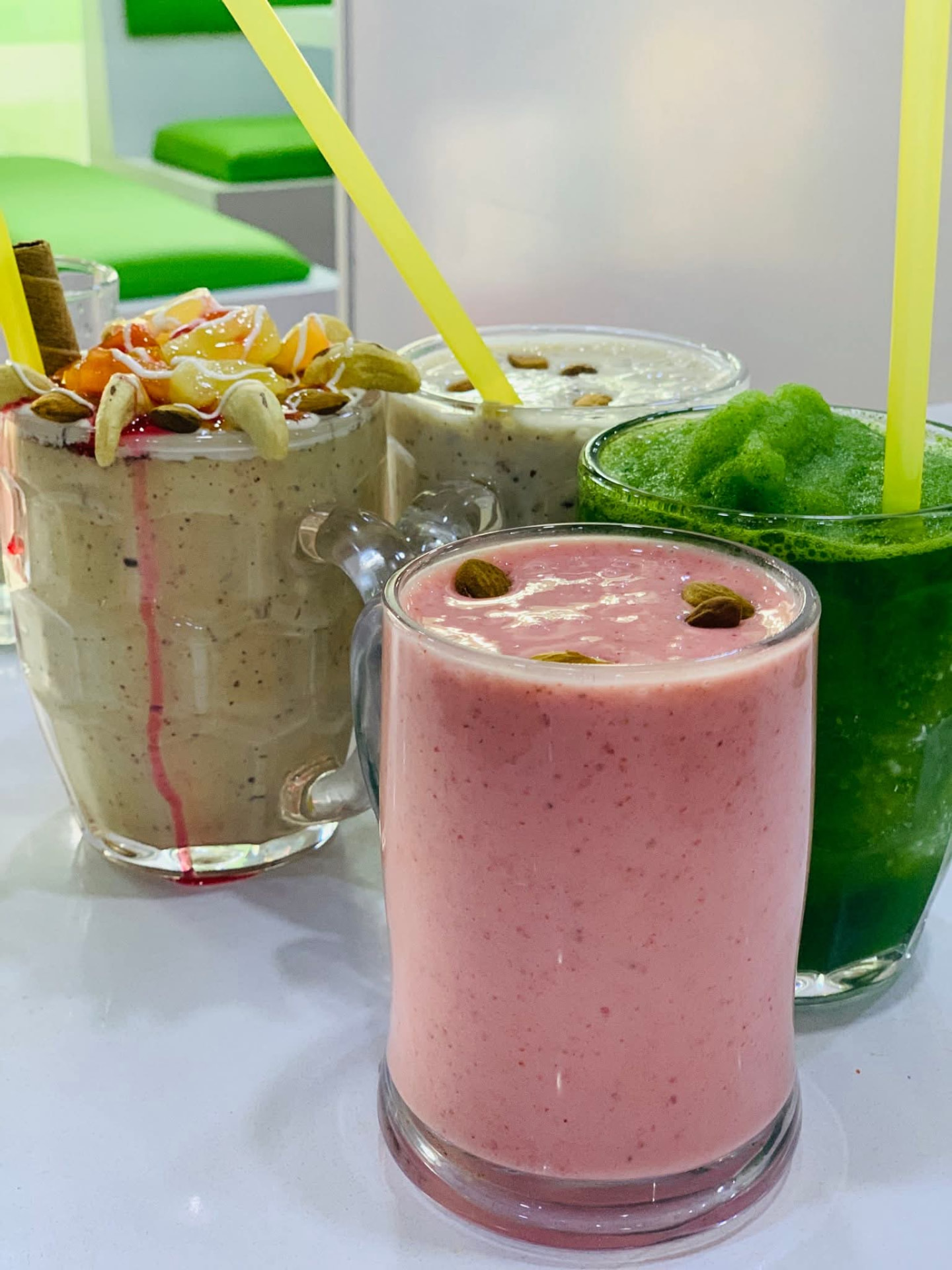 Pink, green and nut shakes served at Afghan Sadaqat