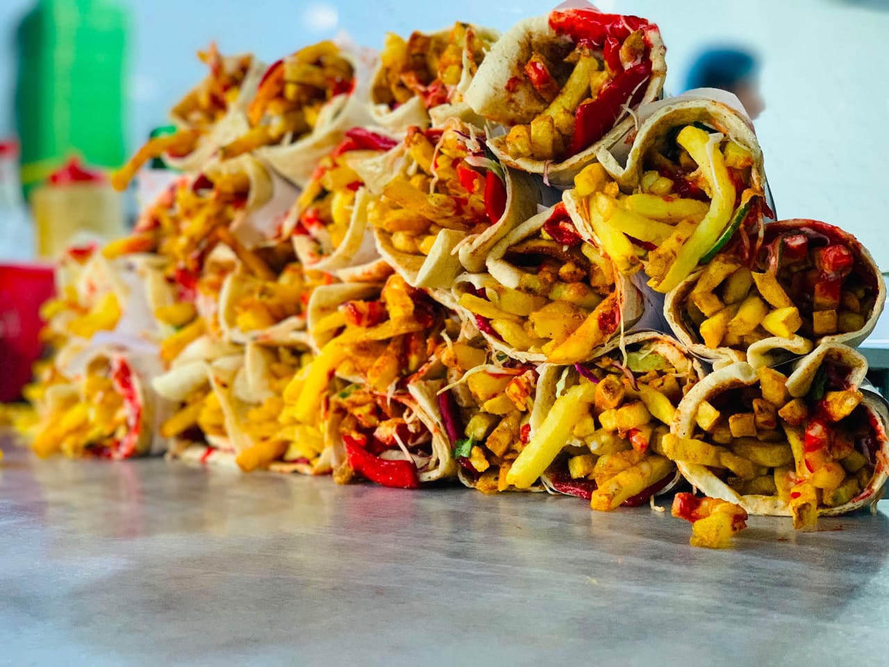 Freshly prepared Afghani shawarma wraps filled with fries